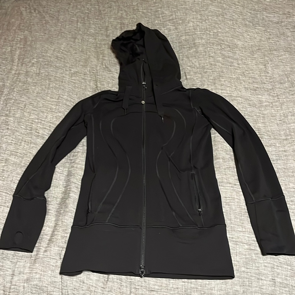 Lululemon black hooded jacket with pockets.